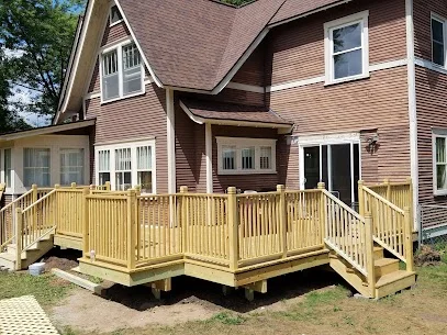 Completed cedar deck with white spindle railings, Chippewa Valley WI