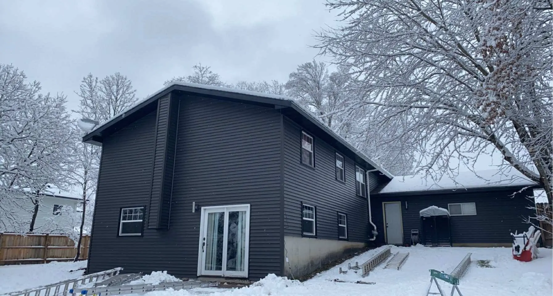 Completed charcoal lap siding on two-story house, Chippewa Valley WI