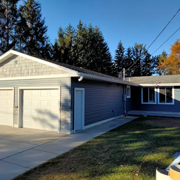 Side view of gray garage and house exterior, Chippewa Valley WI