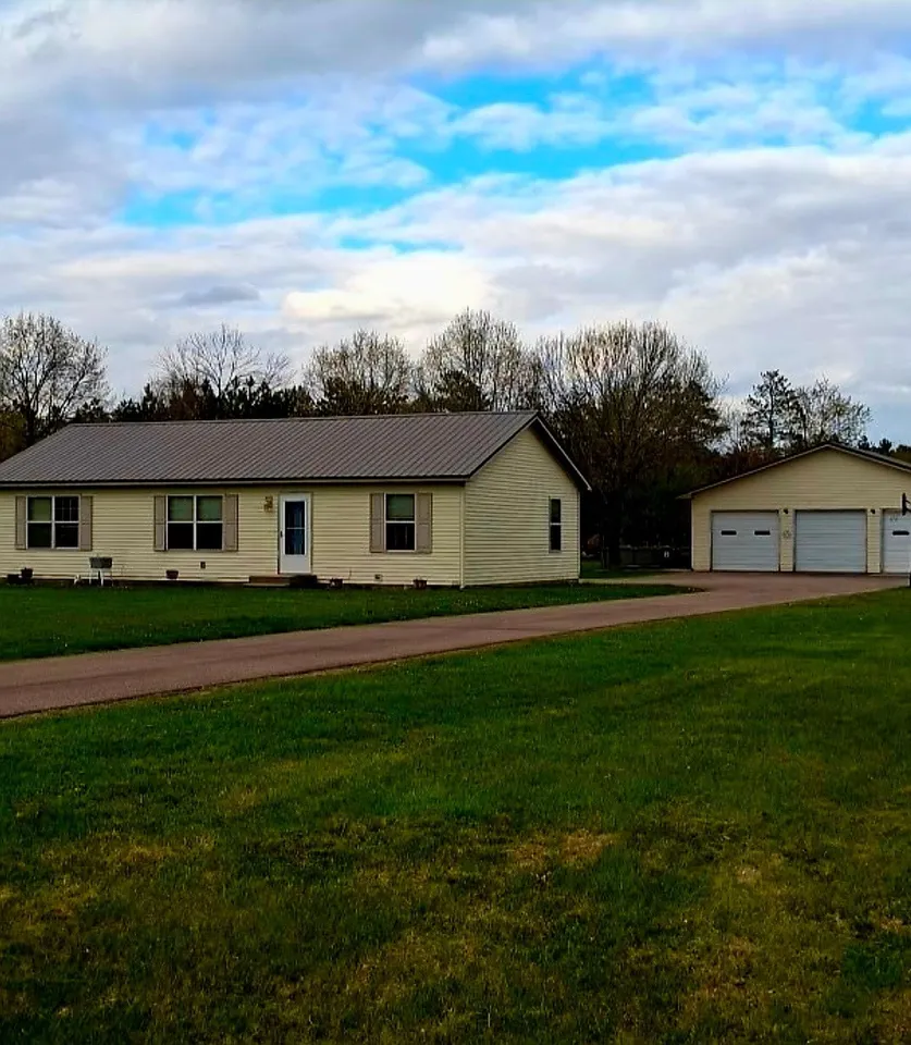 Before — existing exterior prior to siding installation, Chippewa Valley WI